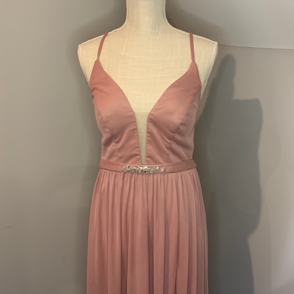 Woman’s bridesmaid dress size 8 dirty pink color. As is condition ,used